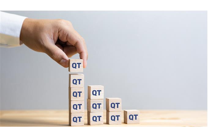 Man placing QT blocks on top of each other